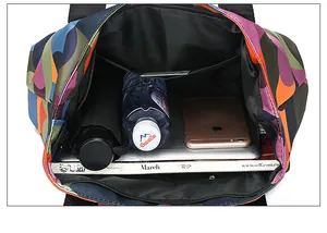 Spacious tote bag interior showing multi-color pattern and 13-inch laptop storage
