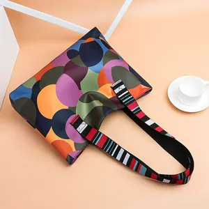 Colorful geometric tote bag in oxford fabric with striped handles for women's casual style