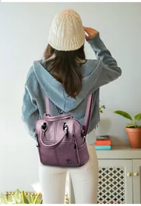 Detail of lavender sheepskin backpack with diamond stitching and kangaroo logo plaque