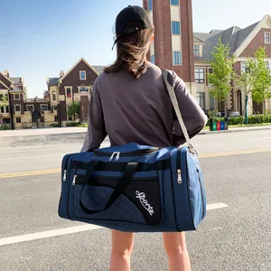 Navy blue quilted sports duffle bag with crossbody strap for gym and travel