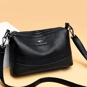 Bolso cubo vintage de cuero negro con cremalleras triples y correa de hombro ajustable