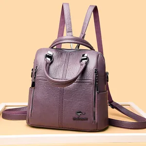 Purple sheepskin leather backpack with quilted stitching and metal kangaroo emblem