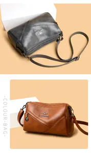 Détail d'un sac bandoulière vintage en cuir PU avec surpiqûres en V et logo chic