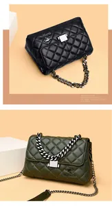 Detail of quilted diamond pattern and metallic kangaroo logo on chic crossbody bag