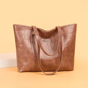 Brown crocodile embossed leather tote bag with sturdy double handles for women
