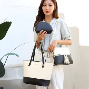 Three-piece women handbag set including black and white contrast tote, tassel bag and pouch