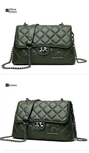 Macro detail of dark green quilted leather bag featuring a metal kangaroo logo and turn-lock