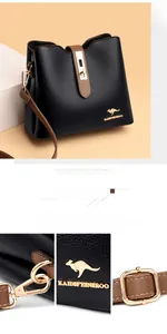 Close-up of polished metal hardware and embossed kangaroo logo on a leather bucket bag