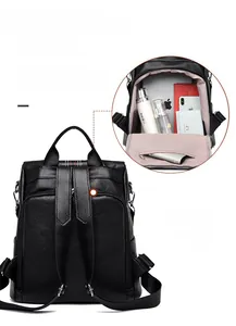 Detail of hidden anti-theft zipper on back of black lychee texture leather backpack