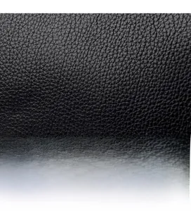 Macro detail of high-quality black pebbled leather texture with comfortable soft touch