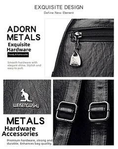 Detail of silver polished hardware zippers and logo on black litchi grain leather bag