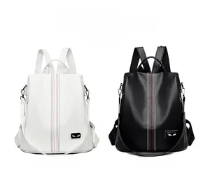 Detailed comparison of white and black lychee textured backpacks with monster eye detail