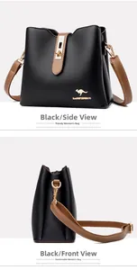 Close-up of black lychee leather texture and golden kangaroo hardware on bucket bag