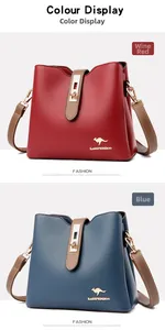 Detail of leather bucket bags in wine red and blue featuring gold logo and metal buckles