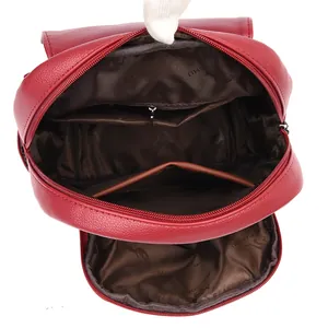 Large capacity red leather backpack with multiple interior pockets and zipper storage
