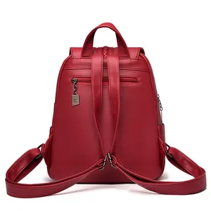Rear view of burgundy faux leather backpack with anti-theft zipper and litchi texture
