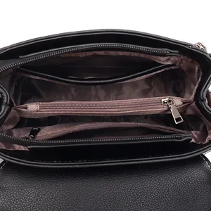 Black crocodile pattern shoulder bag with multiple compartments and brown satin lining