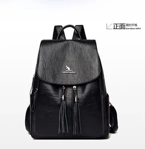 Front view of black leather backpack with lychee texture and decorative tassels