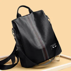 Fashionable black pebbled leather backpack with contrast stitching and monster eye detail