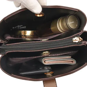 Interior view of the contrast kangaroo bucket bag showing large capacity and compartments