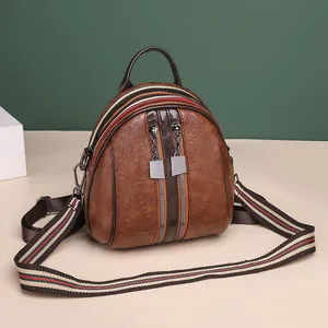 Brauner Vintage Lederrucksack für Damen mit modischen gestreiften Canvas Schultergurten