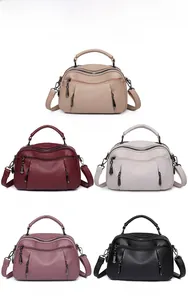 Boston bag collection in five colors: khaki, red, white, pink and black textured leather
