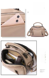 Internal compartments of the beige leather Boston bag showing ample storage space