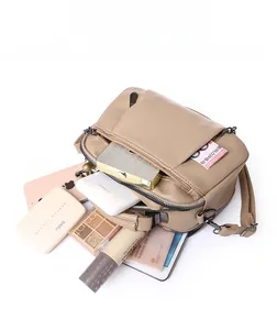 Top view showing large capacity of the brown pleated Boston bag with multi-layer zippers