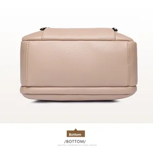 Detailed bottom view showing lychee pattern leather texture and premium stitching