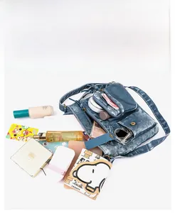 Flat lay view of high-capacity denim bucket bag showing large interior space for items