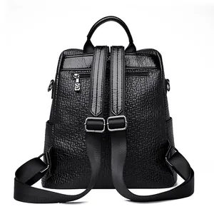 Chic black leather backpack with bear rhinestone design and adjustable nylon straps