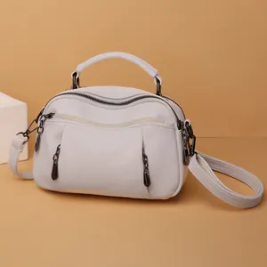 White lychee pattern Boston bag with dual zippers and dark metal hardware for women