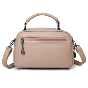 Chic beige lychee grain leather Boston bag with single handle and crossbody strap