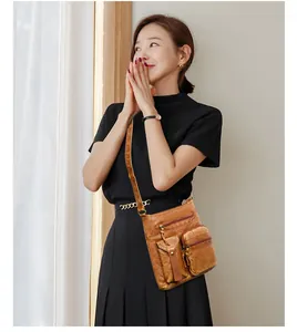 Vintage brown leather crossbody bucket bag featuring multiple functional zipper pockets