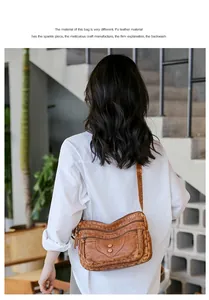 Detail of vintage brown multi-zipper crossbody bag with metal buttons and soft PU leather