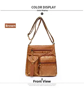 Close-up of brown PU leather bucket bag featuring vintage pleated texture and bronze zippers