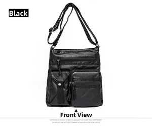 Front view of black denim-textured PU leather bucket bag with multiple pockets and bronze zippers
