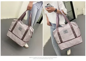 Λεπτομέρεια τσάντας ταξιδιού με μοτίβο houndstooth και θήκη παπουτσιών στο κάτω μέρος
