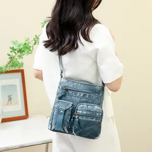 Retro washed blue denim bucket bag for women with multi-pocket and vintage metal details