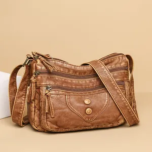 Vintage brown washed PU leather crossbody bag with multi-pocket rivets and wide strap