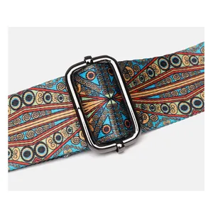 Close-up of wide ethnic fabric strap with colorful geometric patterns and metal buckle