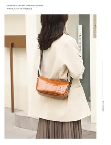 Back view of a model wearing a brown vintage leather cylinder bag with geometric strap