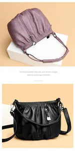 Detailed view of genuine leather bucket bag showing soft pleated texture and metal charm
