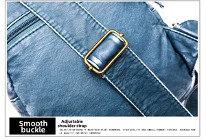 Detailed macro view of the blue textured leather bag with adjustable bronze metal buckle