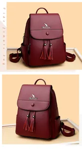 Detail view of burgundy pebble leather backpack with tassel and kangaroo logo