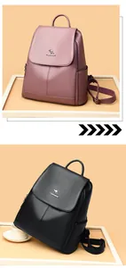 Detail of purple and black soft leather backpacks with litchi grain and metal logo