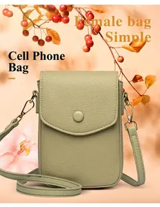 Detailed macro view of mint green leather phone bag with lychee texture and button closure