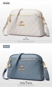 Close-up of beige and light blue leather bags with checkered embossed pattern and metal logo