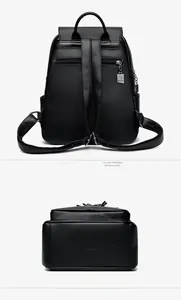 Detail of black pebbled leather backpack showing anti-theft back pocket and embossed bottom