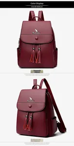 Detailed front and side view of burgundy leather backpack with tassel and kangaroo logo